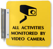 Double sided projecting signs with gold brackets
