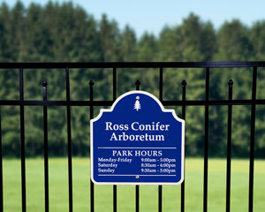 Metal sign on fence