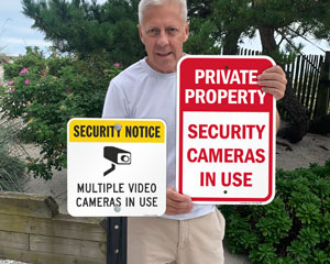 Security cameras in use signs