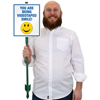 Smile you are being videotaped Lawnboss sign